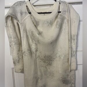 Open shoulder / off the shoulder long sleeve top.
